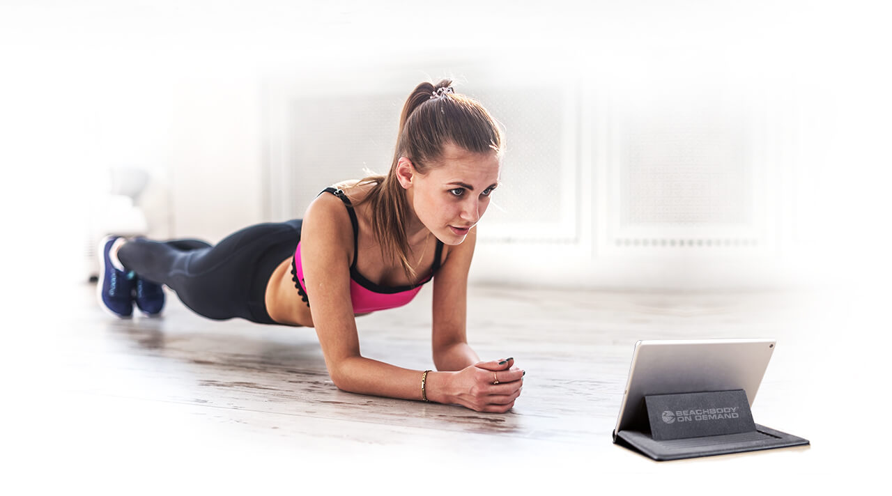 Woman with tablet working out
